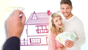 Coppia felice con casa e soldi (Depositphotos foto) - www.buildingcue.it